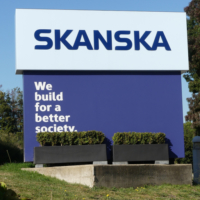 Sign outside multinational construction and development company Skanska’s UK head office reading we build for a better society.