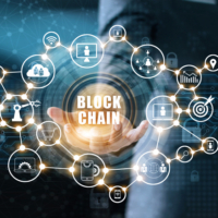 Blockchain technology and network concept. Businessman holding text blockchain in hand with icon network connection on blue security  and digital connection background